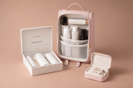 The Bridal Bliss Capsule featuring a pink ritual travel case, bridal skincare kit, and vow keeper jewelry case arranged on a soft neutral background.